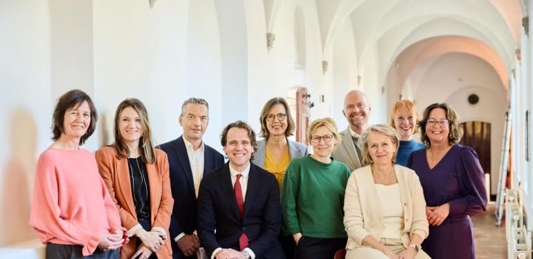 Foto van de sprekers op de bijeenkomst